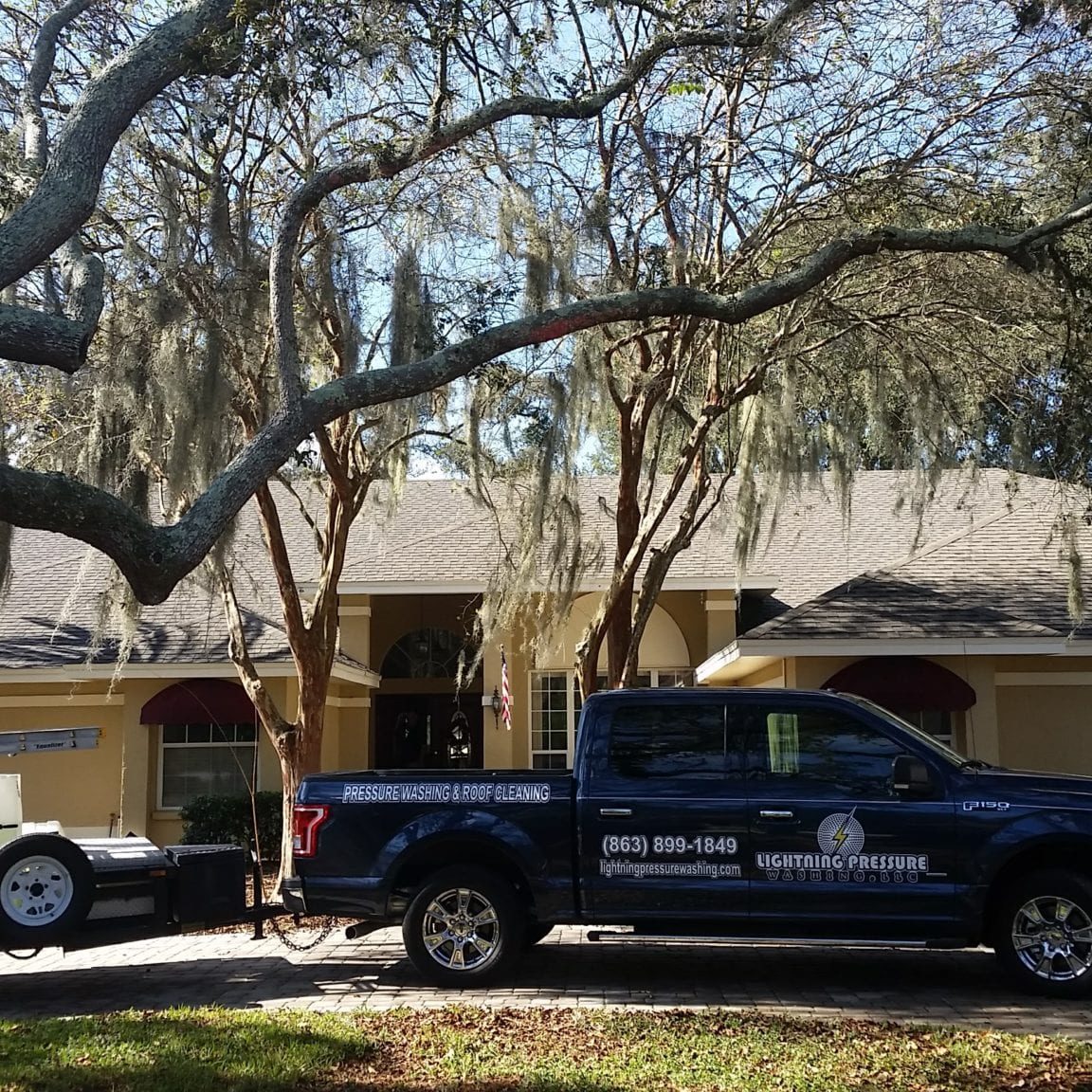 lightning pressure washing truck after roof cleaning job